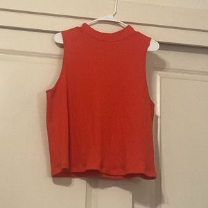 Fitted sleeveless mock-neck top